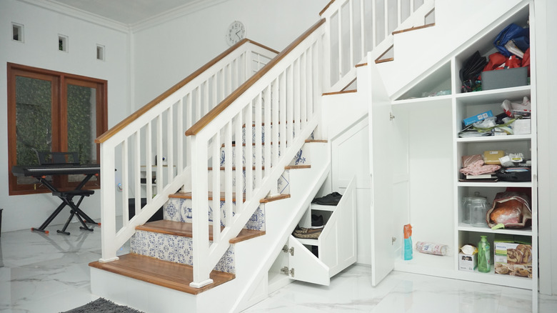additional cabinets under stairs