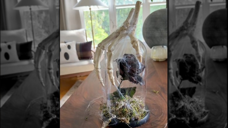 Rose and creepy hand glass cloche design