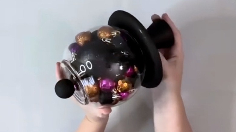 Black glass cloche with halloween ornaments