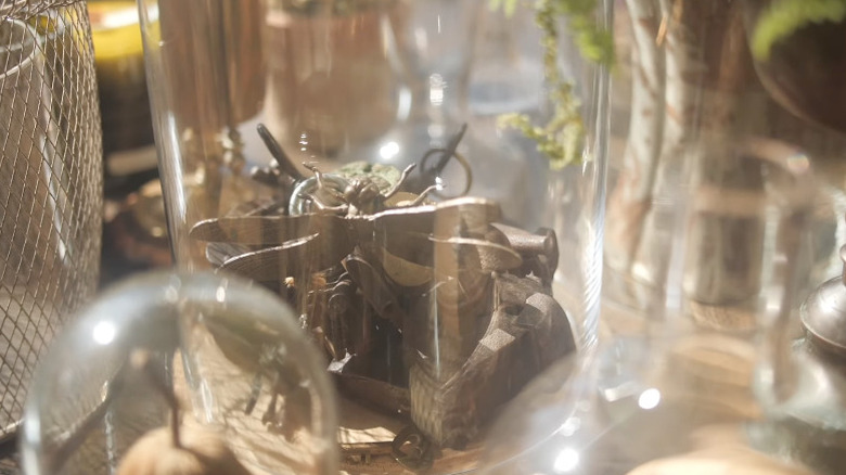 Rustic cloche filled with bronze keys