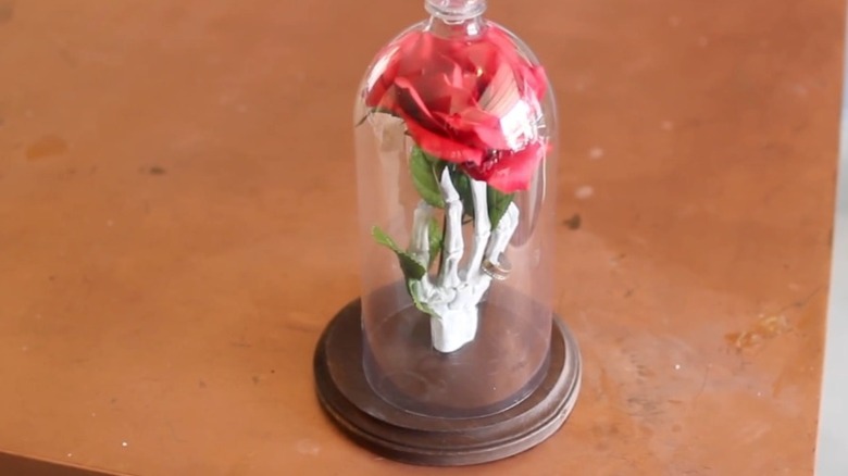 Rose and skull hand glass cloche