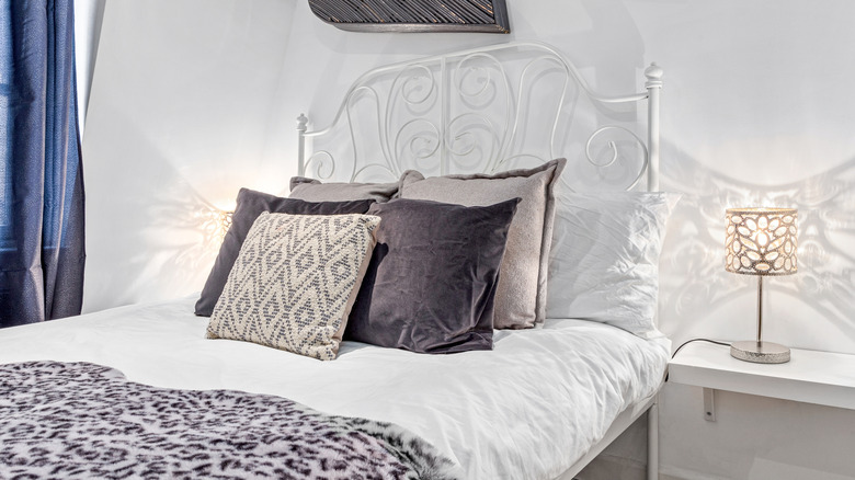 Leopard-print throw on the foot of a bed