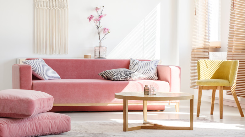 Living room with a pink velvet couch