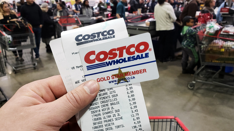 hand holding costco receipt