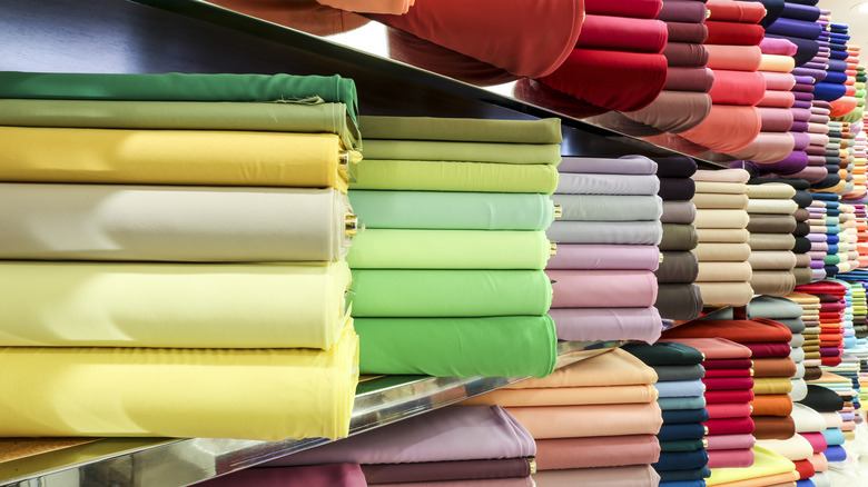 Shelved bolts of colorful fabric