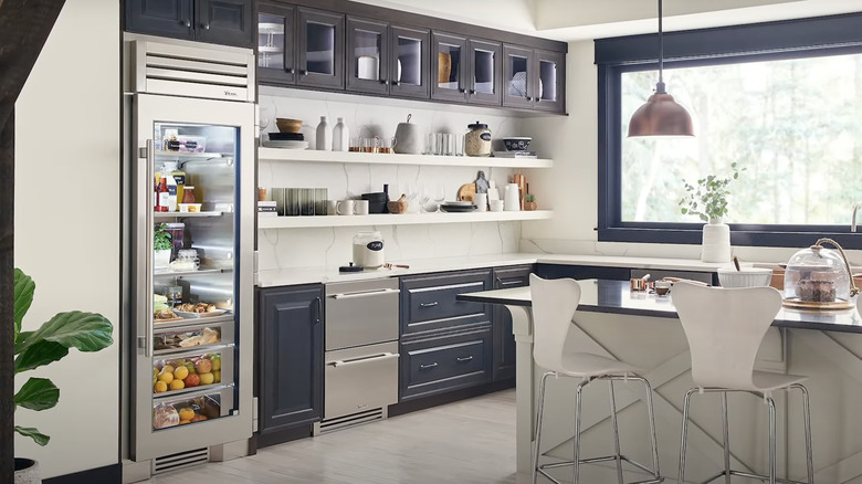 modern kitchen with glass refrigerator