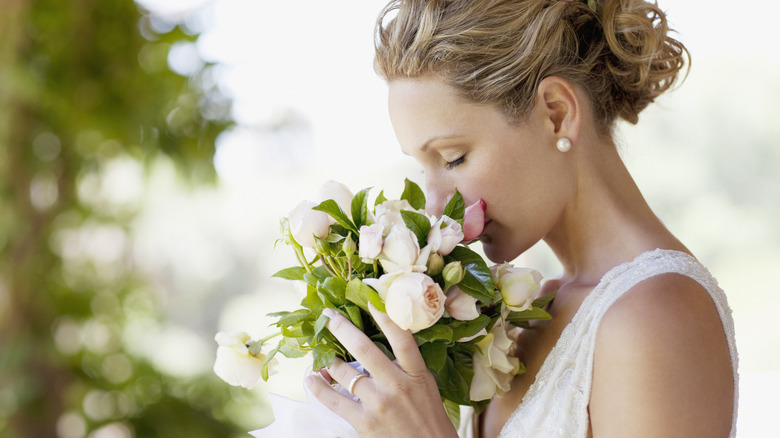 bride smelling bouquet