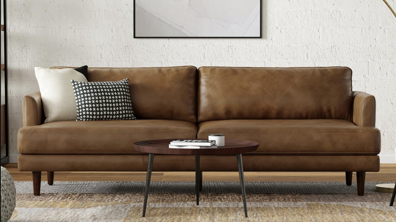 SimpliHome's Livingston leather sofa in caramel brown in a living room