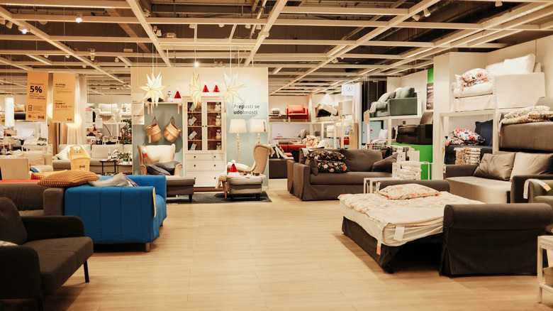 Orange sofa in contemporary living room with throw and yellow cushions