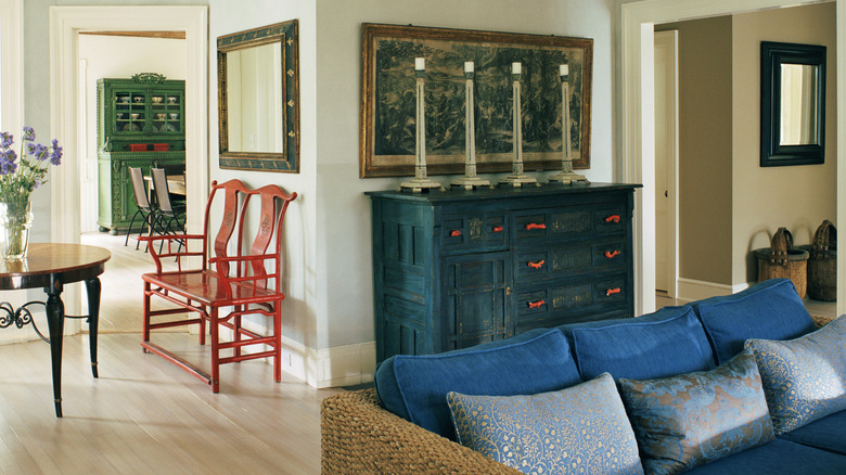 Home interior with unique, colorful furniture, including vintage pieces and modern silhouettes