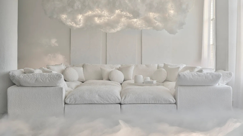 A white living room with floating clouds.