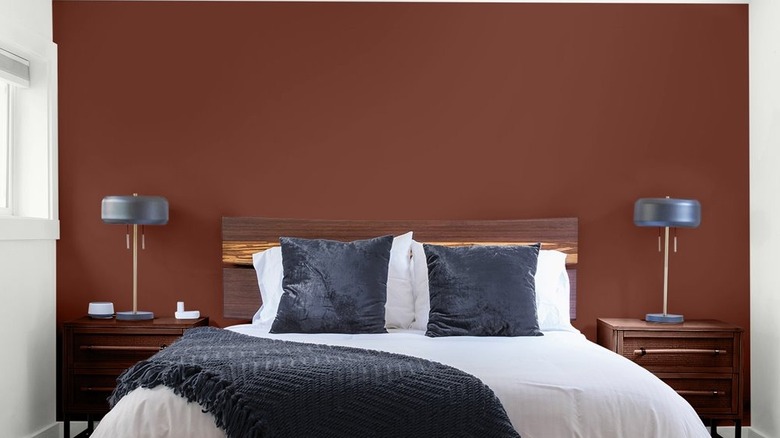 A mahogany accent wall in a modern bedroom.