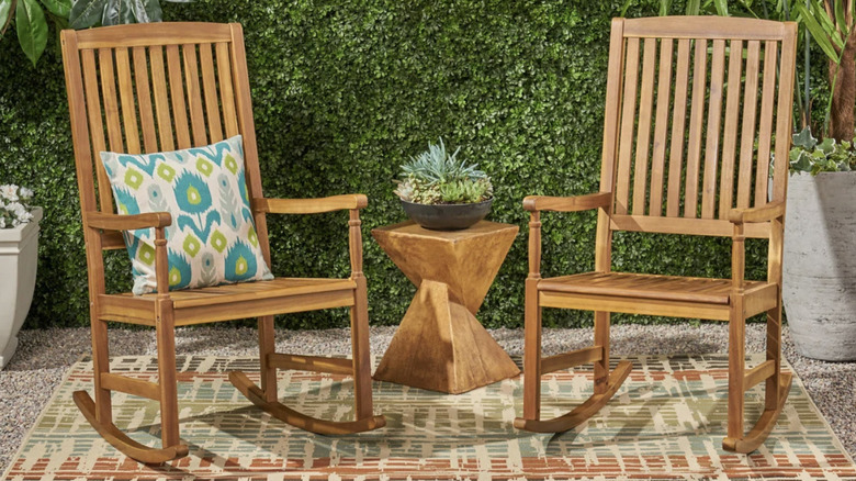 Acacia wood rocking chairs on patio