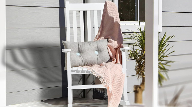 White wooden rocking chair on patio