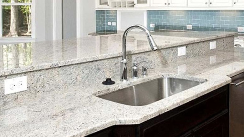 Modern kitchen with Kashmir White granite countertops