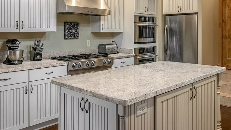 Modern kitchen with Salinas White granite countertops