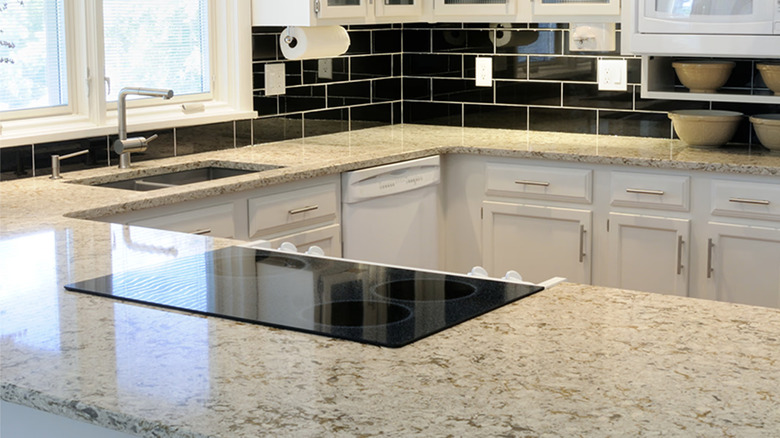Modern kitchen with White Mist granite countertops