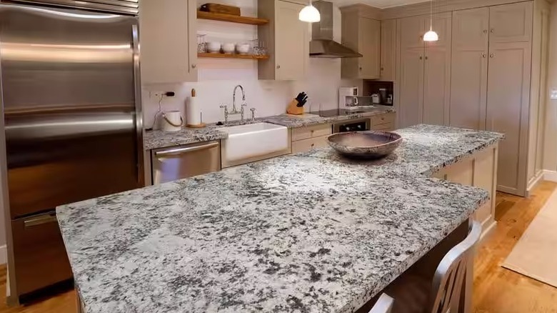 Modern kitchen with White Pebble granite countertops