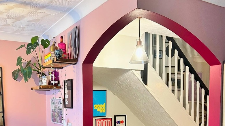 red painted arch between rooms