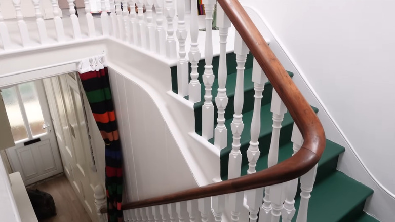 green painted stairs white walls