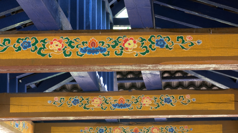 wood beams painted with flowers