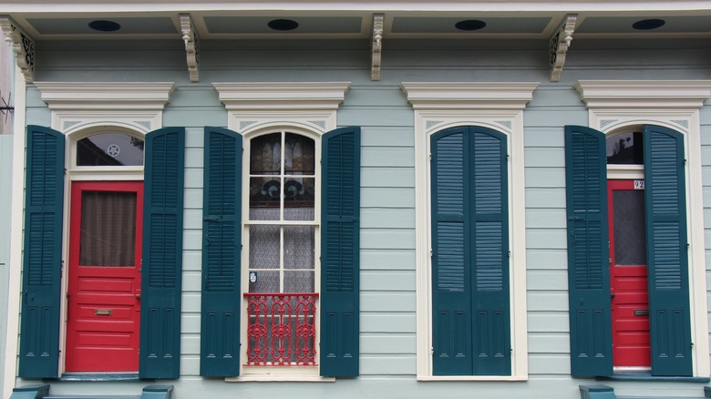 Red doors with blue shutters