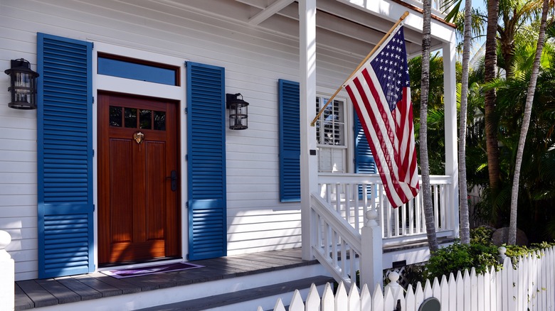 Wood door with blue shutters