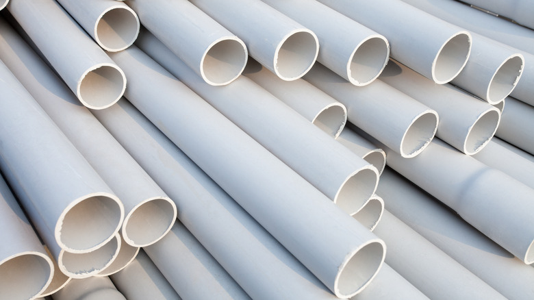 stacked white pvc pipes