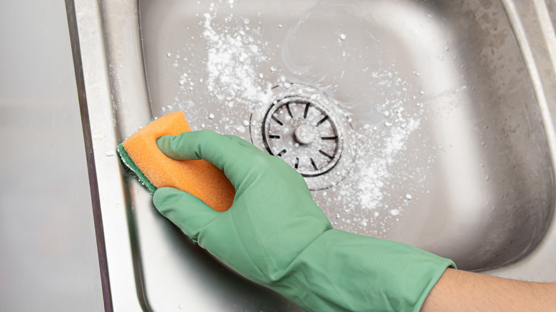 Cleaning hard water stains on sink with cornstarch