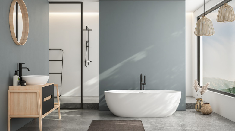 Blue-gray bathroom with black sink