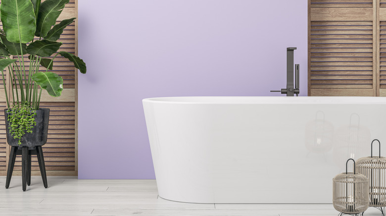 Purple bathroom with white tub