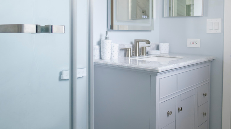 Dusty blue bathroom with matching accents