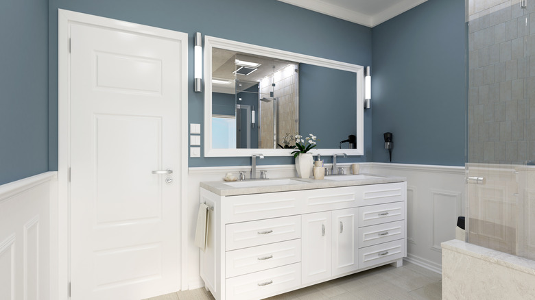 Green-blue bathroom with white accents