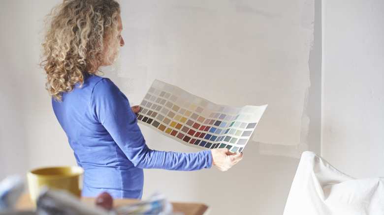 Someone looking at paint options for home