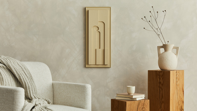 Modern artwork on minimalist living room wall