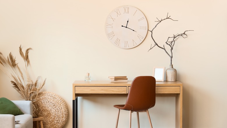 Stylish clock over desk
