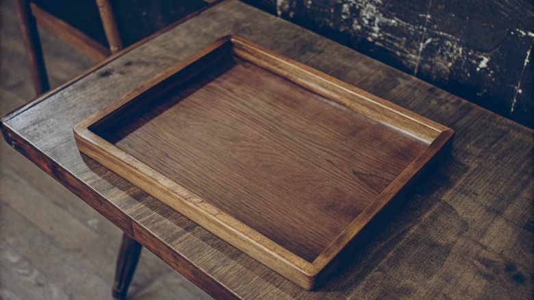 Simple rustic wood tray on coffee table