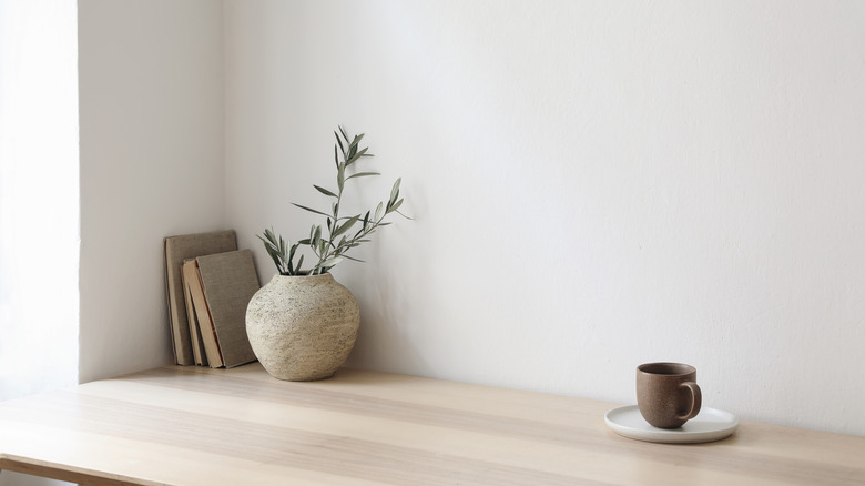 Plain vase on minimalist shelf