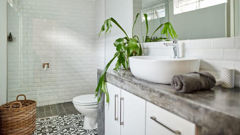 A small bathroom with patterned floor