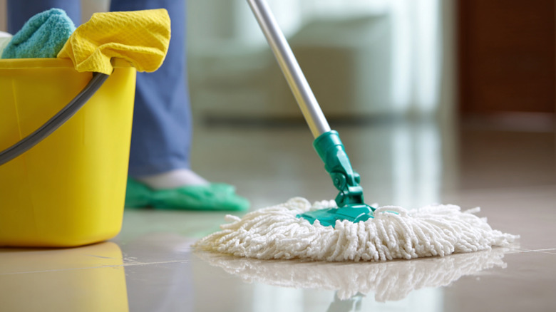 A person mopping a floor