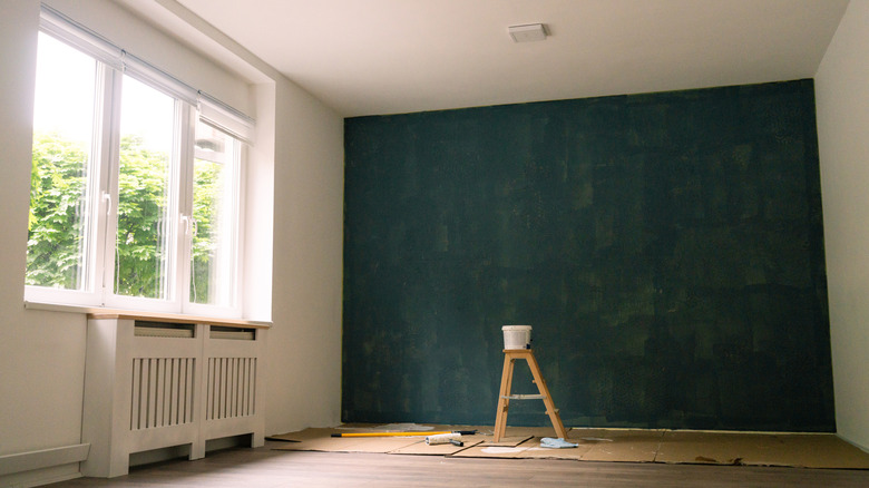 An empty room with paint waiting to dry