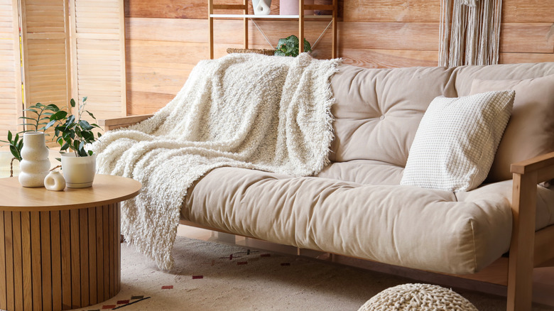 couch decorated with cozy throw