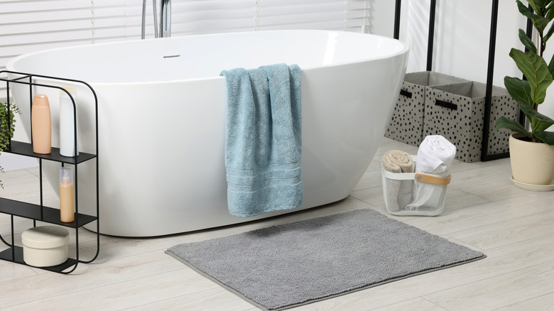 bathtub with fuzzy bath mat