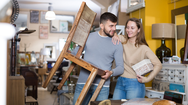 couple shopping for second-hand furniture