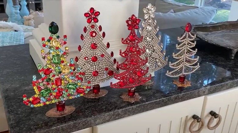 Vintage Czech rhinestone Christmas trees in red, yellow, green, white, and other colors.