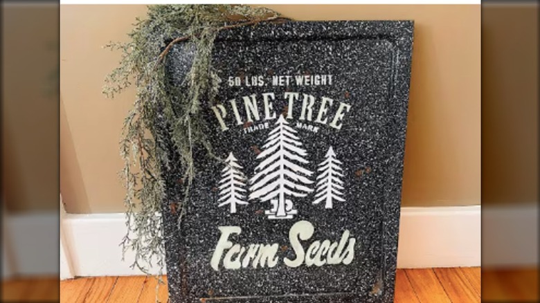 An enamel drip pan decorated with a stencil.