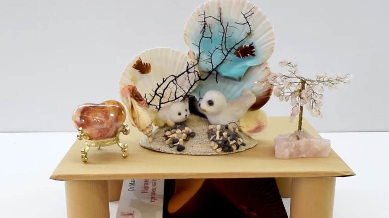 Shelf with home decor items on it.
