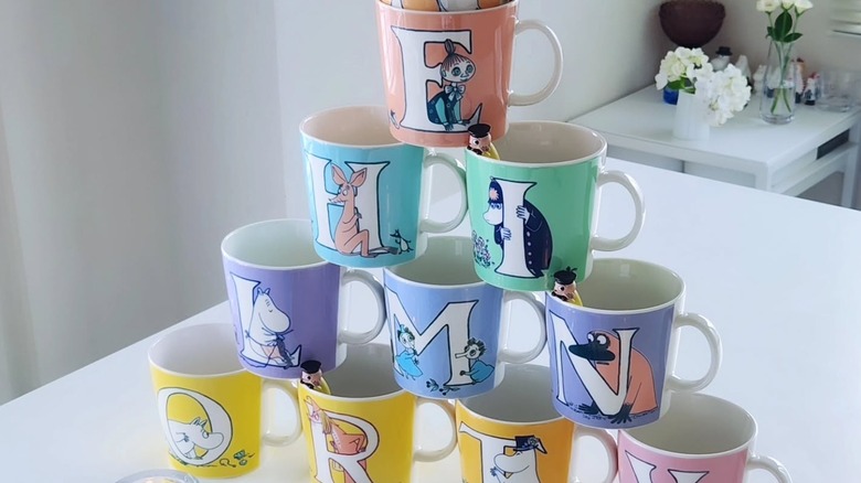 A tower created out of colorful mugs