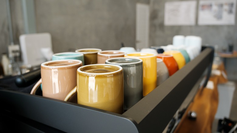 Colorful mugs on a countertop