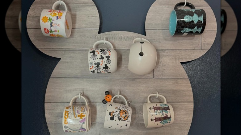 Mugs on a Mickey Mouse-shaped wood background